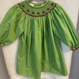 Excellent used condition, green with red polka dot smocked dress, size 12 mo.